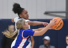 Staff photo by Matt Hamilton/ CCS (11) Momo Moore tries to steal the ball from Cleveland High (1) Laney Copeland during their game at Chattanooga Christian School on Tuesday, December 3, 2024.