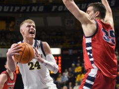Staff photo by Matt Hamilton / UTC's Garrison Keeslar (24) drives into the paint as Samford's Riley Allenspach defends during a SoCon basketball game Thursday night at McKenzie Arena.