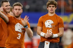 AP photo by Gareth Patterson / Texas quarterback Arch Manning (16) warms up alongside quarterback Quinn Ewers (3) prior to the Cotton Bowl College Football Playoff semifinal game against Texas, Friday, Jan. 10, 2025, in Arlington, Texas.