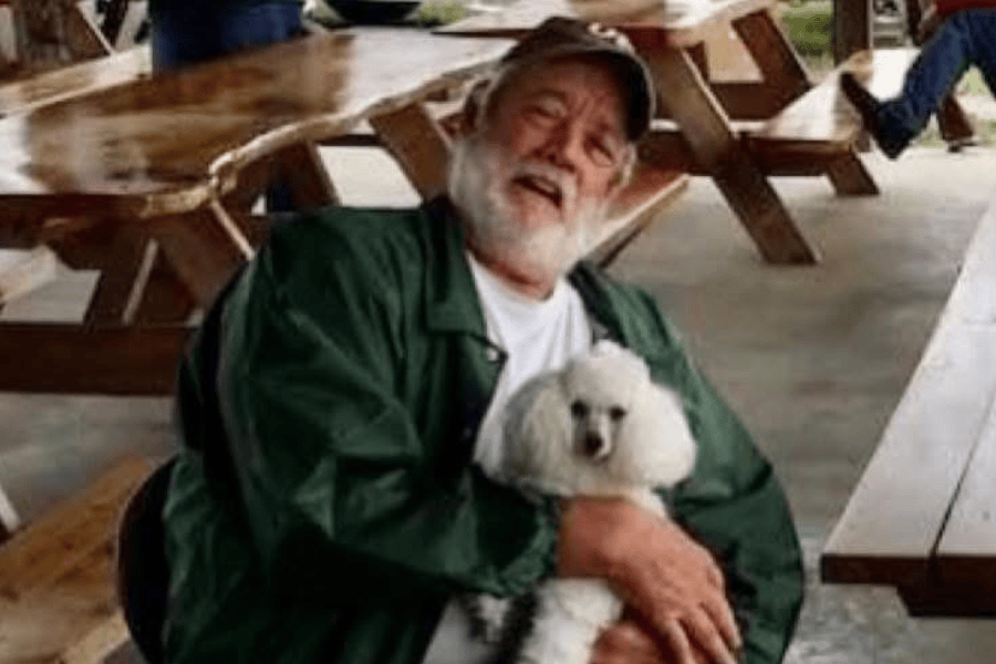 Contributed photo / Wade Frazier, of White Pine, Tenn., holds his poodle, Lucy, at an event at Hog Heaven Gun Club.