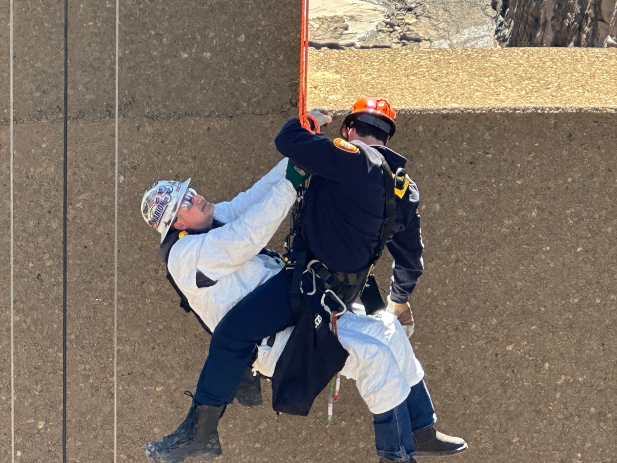 Chattanooga Fire Department / Chattanooga Fire, Hamilton County EMS and TVA officials rescued two workers at TVA's Pump Storage Facility on Raccoon Mountain on Friday. Crews were doing maintenance when their man basket malfunctioned 150 feet down and wouldn't come back up.