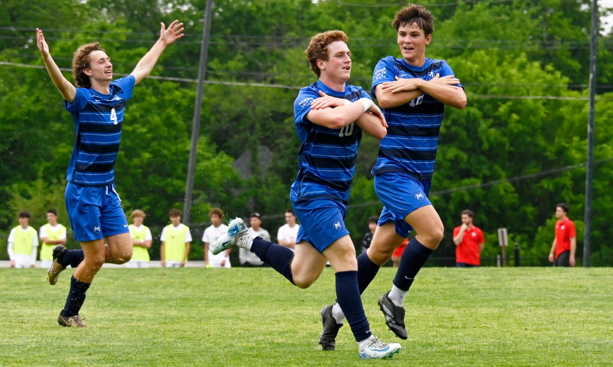 Staff photo by Abby White / Elliot Arnold, center, celebrates with teammates Cy Shumate (4) and Grant Doller after scoring for McCallie during Friday's 3-0 home win against Baylor in a TSSAA Division II-AA East Region game. It was senior night for the Blue Tornado.