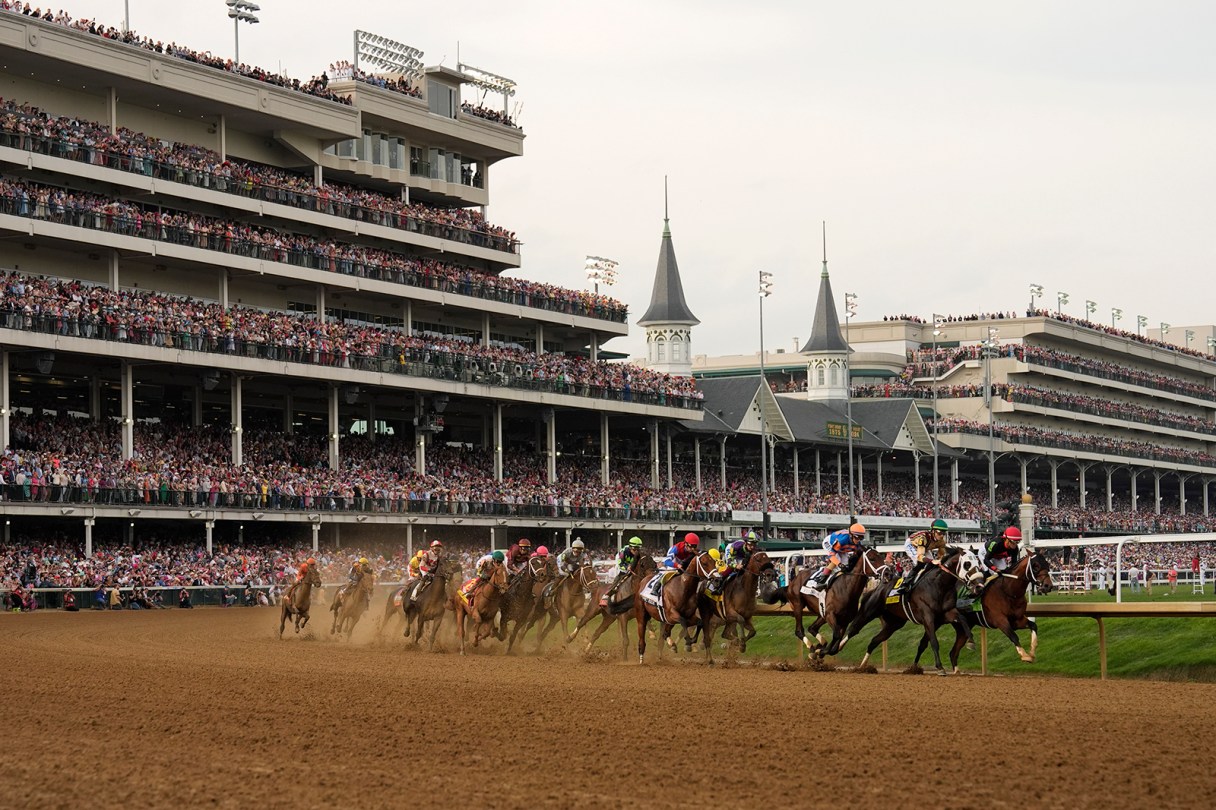 AP photo by Brynn Anderson / Horses come through the first turn at Churchill Downs during the 150th running of the Kentucky Derby with the Louisville track's iconic twin spires in the background on May 4, 2024.