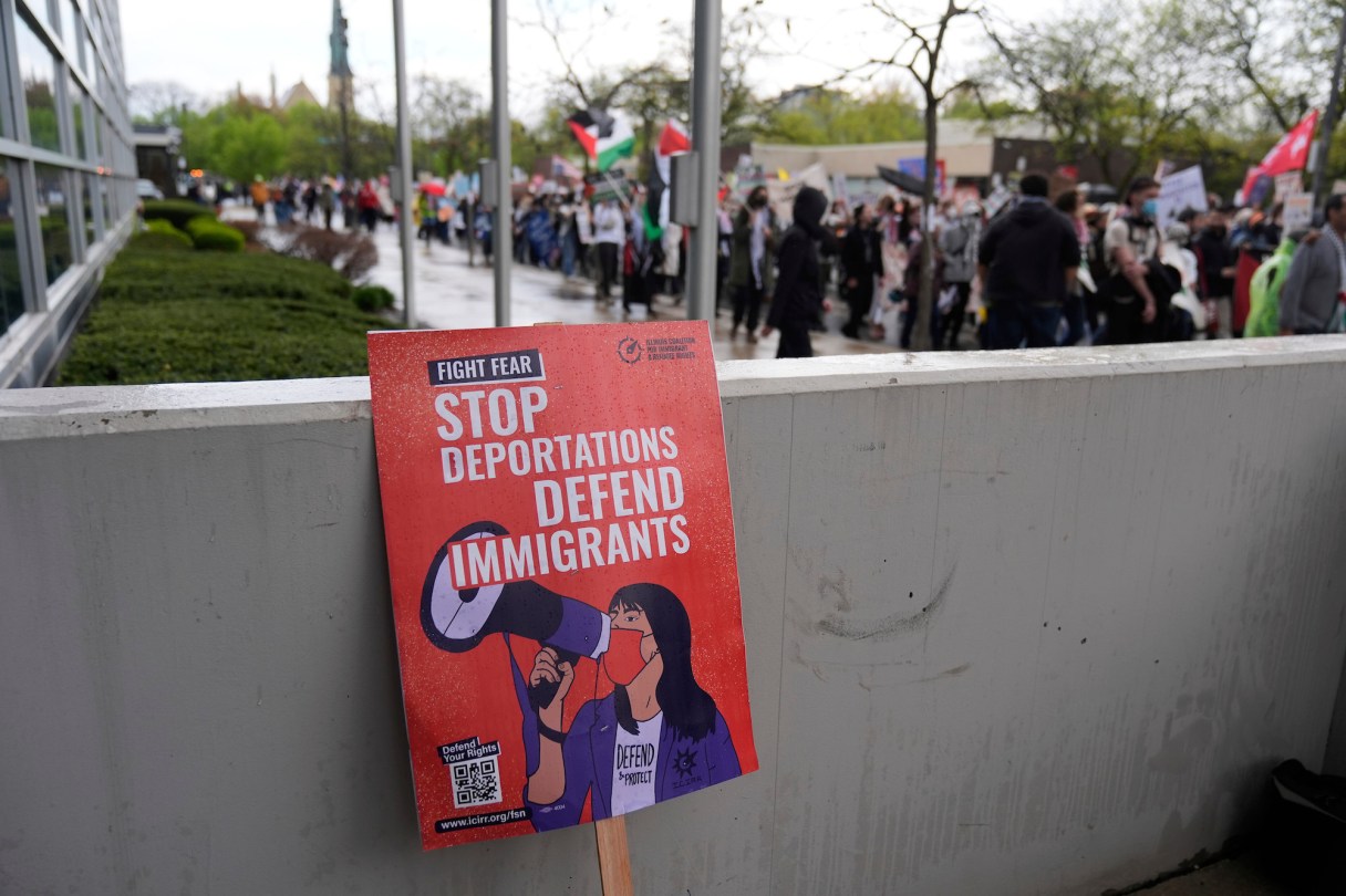 A sign protesting the deportation of immigrants is seen as thousands of people march in a May Day rally and protest Thursday, May 1, 2025, in Chicago. (AP Photo/Erin Hooley)