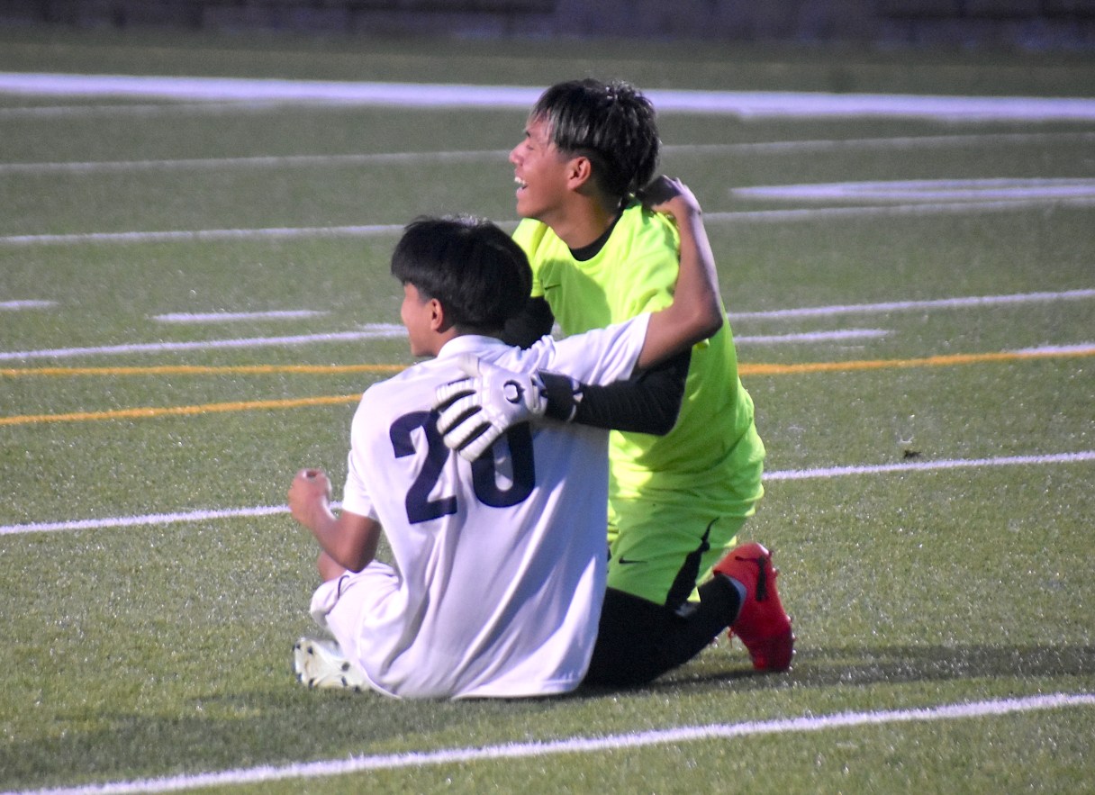 Staff photo by Patrick MacCoon / Chattanooga Prep juniors Erick Hernandez (20) and Welfran Ramirez celebrate Thursday night after the Sentinels won 1-0 at Chattanooga School for the Liberal Arts to win the TSSAA Region 3-1A soccer final.