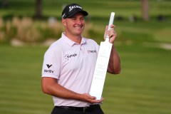 Sepp Straka, of Austria, poses with the trophy after winning the Truist Championship golf tournament at the Philadelphia Cricket Club, Sunday, May 11, 2025, in Flourtown. (AP Photo/Matt Rourke)