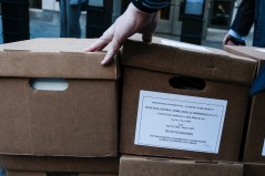 FILE — Workers handle boxes of documents related to the landmark Meta antitrust trial outside the federal courthouse in Washington, April 16, 2025. The Federal Trade Commission has accused the social media company, which was previously known as Facebook, of acquiring Instagram and WhatsApp when they were tiny start-ups in a “buy-or-bury strategy” to snuff out competition. (Michael A. McCoy/The New York Times)
