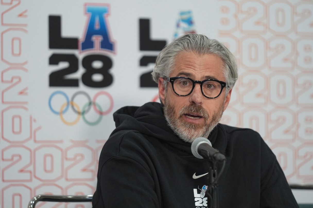 AP photo by Damian Dovarganes / Casey Wasserman, chairman and president for the organizing committee for the 2028 Los Angeles Olympics, takes questions during a news conference Thursday in the city.