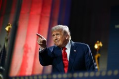President Donald Trump gestures to the crowd after speaking and signing an executive order during an artificial intelligence summit at the Andrew W. Mellon Auditorium in Washington, July 23, 2025. His new executive order included the A.I. Action Plan, which contains policy guidelines to encourage the growth of the artificial intelligence industry in the U.S. (Kenny Holston/The New York Times)