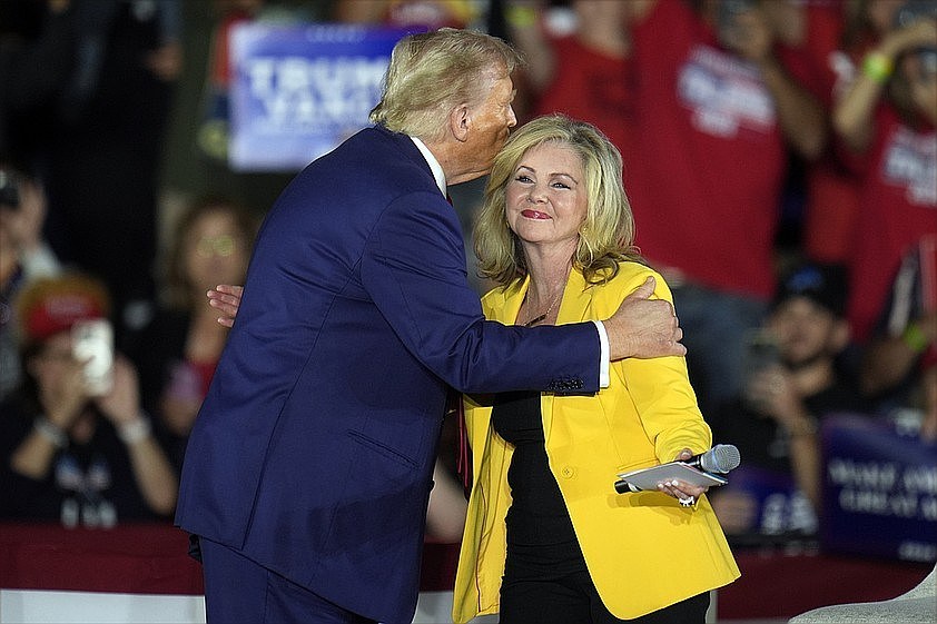 Photo/Paul Sancya/The Associated Press / Then-Republican presidential nominee Donald Trump greets Sen. Marsha Blackburn, R-Tenn., as he arrives for a town hall event at Macomb Community College on Friday, Sept. 27, 2024, in Warren, Mich.
