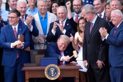 U.S. President Donald Trump bangs a gavel after signing the "Big Beautiful Bill" during a Fourth of July celebration event on the South Lawn at the White House in Washington, D.C., on July 4, 2025. (Yuri Gripas/Abaca Press/TNS)