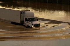 Contributed photo / A truck drives through flooded road in Chattanooga, Tenn., Tuesday, Aug. 12, 2025. (WTVC via AP)