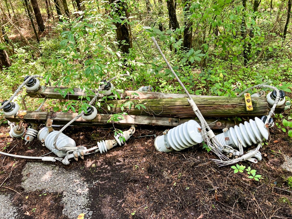 Hamilton County Sheriff's Office / Downed power lines are pictured. Officials allege Joel Donald Brown, 49, of Ooltewah, cut down power poles at the Volunteer Ammunition property and removed and sold the aluminum cable for scrap.