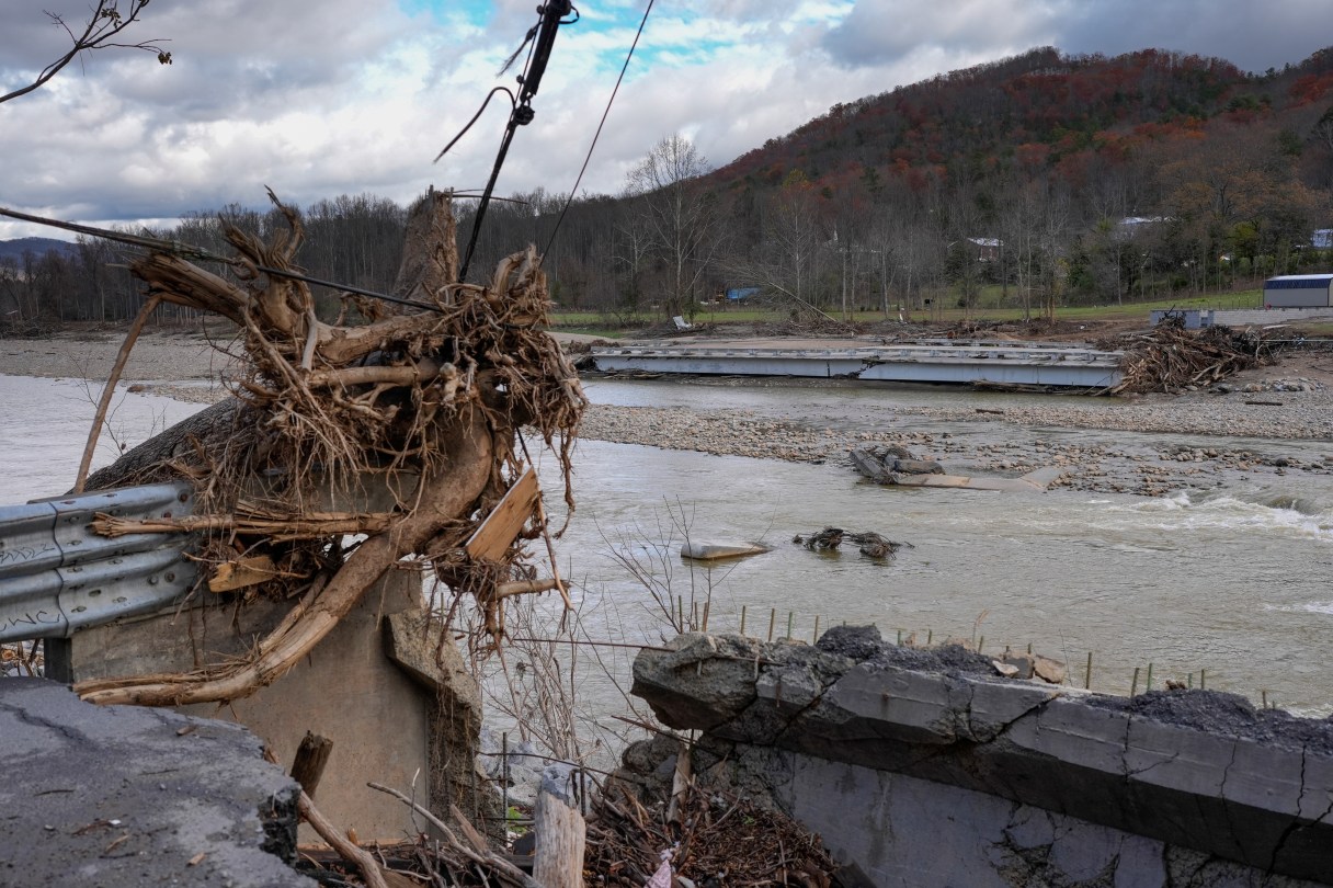 Flood debris from Hurricane Helene is seen on the banks of the Nolichucky River, Friday, Nov. 22, 2024, in Erwin, Tenn. A woman downstream of a TVA dam on the river sued the utility Sept. 25, 2025, for the wrongful death of her parents. (AP Photo/George Walker IV)