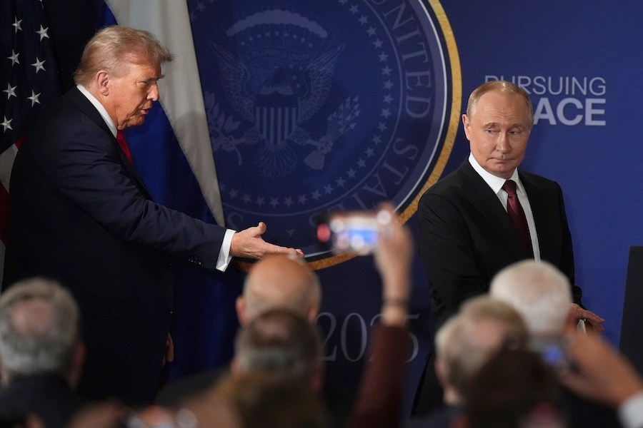 President Donald Trump, left, and Russia's President Vladimir Putin arrive for a joint press conference at Joint Base Elmendorf-Richardson, Alaska, Friday, Aug. 15, 2025. (AP Photo/Jae C. Hong)