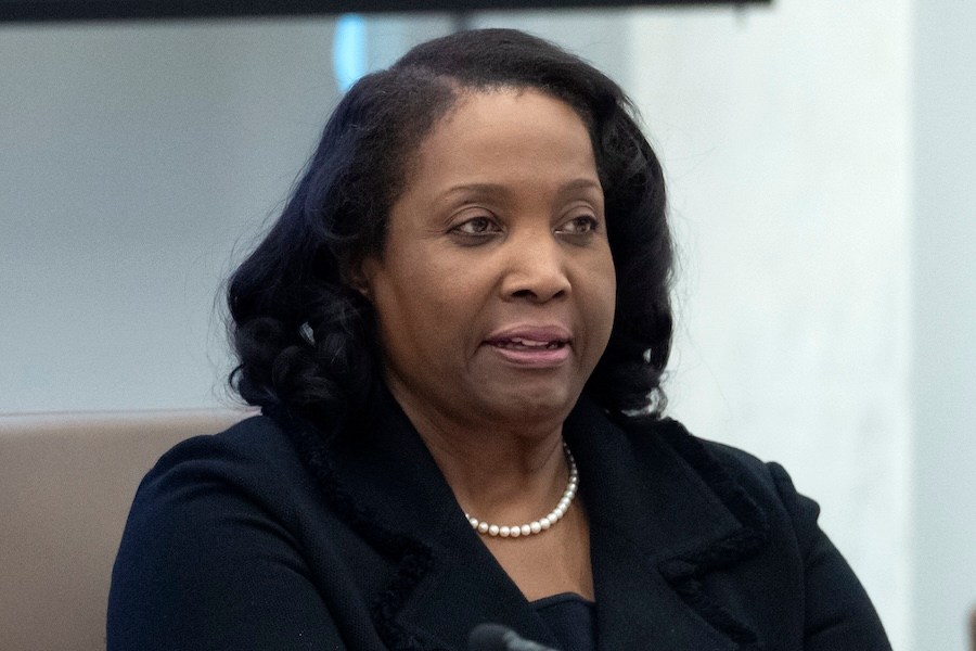 FILE - Federal Reserve Board of Governors member Lisa Cook listens during an open meeting of the Board of Governors at the Federal Reserve, June 25, 2025, in Washington. (AP Photo/Mark Schiefelbein, File)