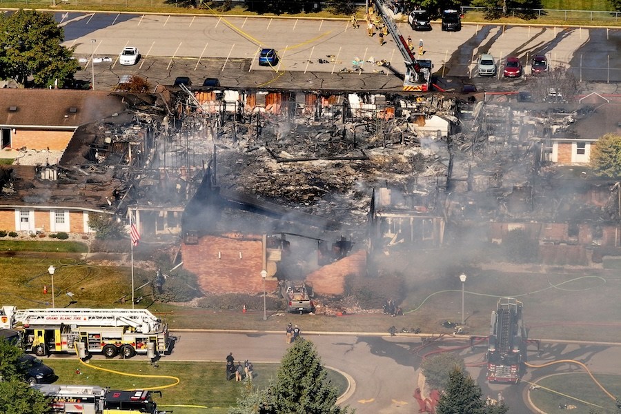 Emergency crews respond to a shooting and fire at The Church of Jesus Christ of Latter-day Saints, in Grand Blanc, Mich., Sept. 28, 2025. (David Guralnick/Detroit News via AP)