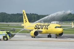 Staff photo by Matt Hamilton / Water cannons spray water in an arch as the first Spirit Airlines plane arrives at the Chattanooga Metropolitan Airport on Wednesday, June 4, 2025.