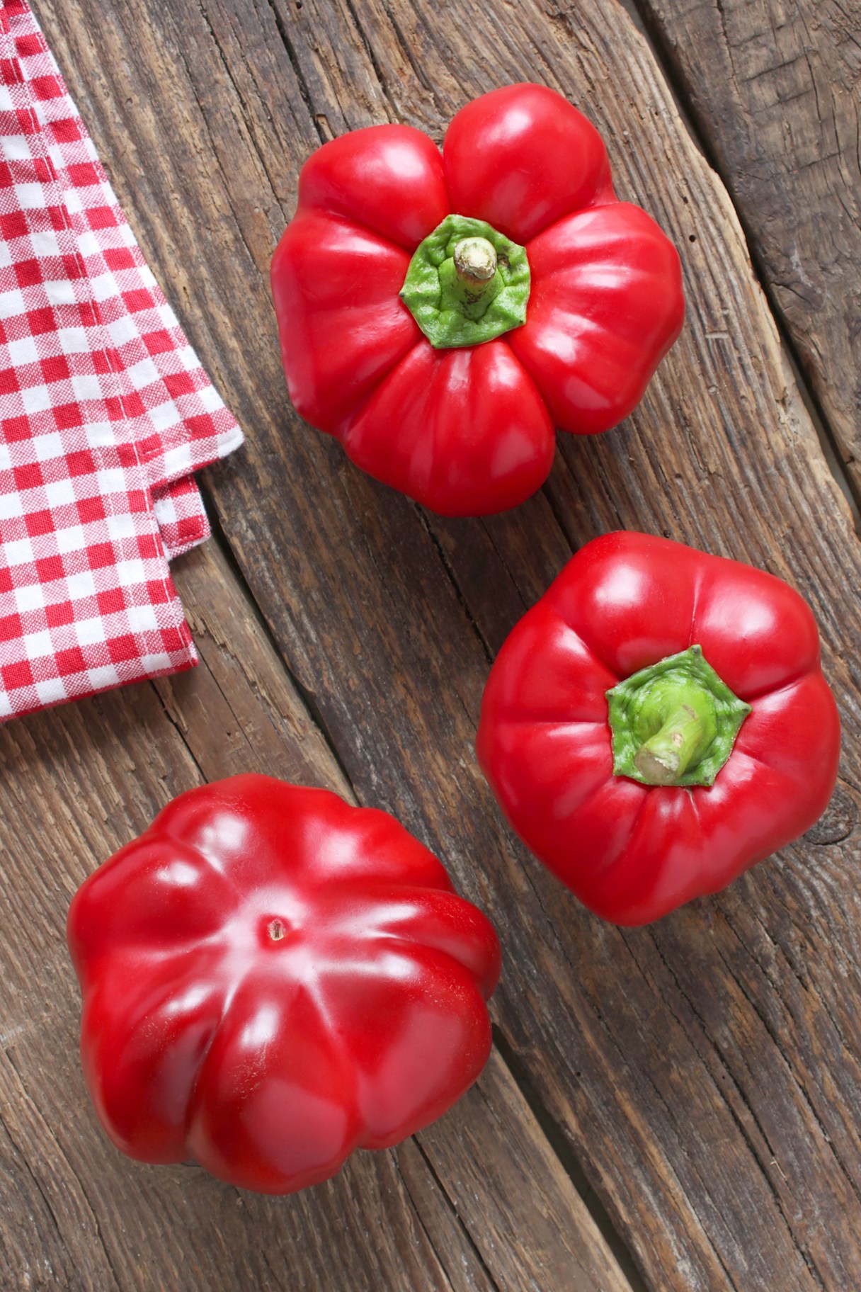 For panzanella, roast red peppers, turning occasionally, until their skins are blackened and blistered all over. / Daioda/Dreamstime/TNS