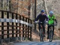 Staff File Photo / Two cyclists ride over an old trestle while on Lookout Mountain's Guild-Hardy Trail. After weeks of clean-up and restoration work, the trail will reopen on Oct. 8., according to members of the Tennessee-based Lookout Mountain Conservancy.