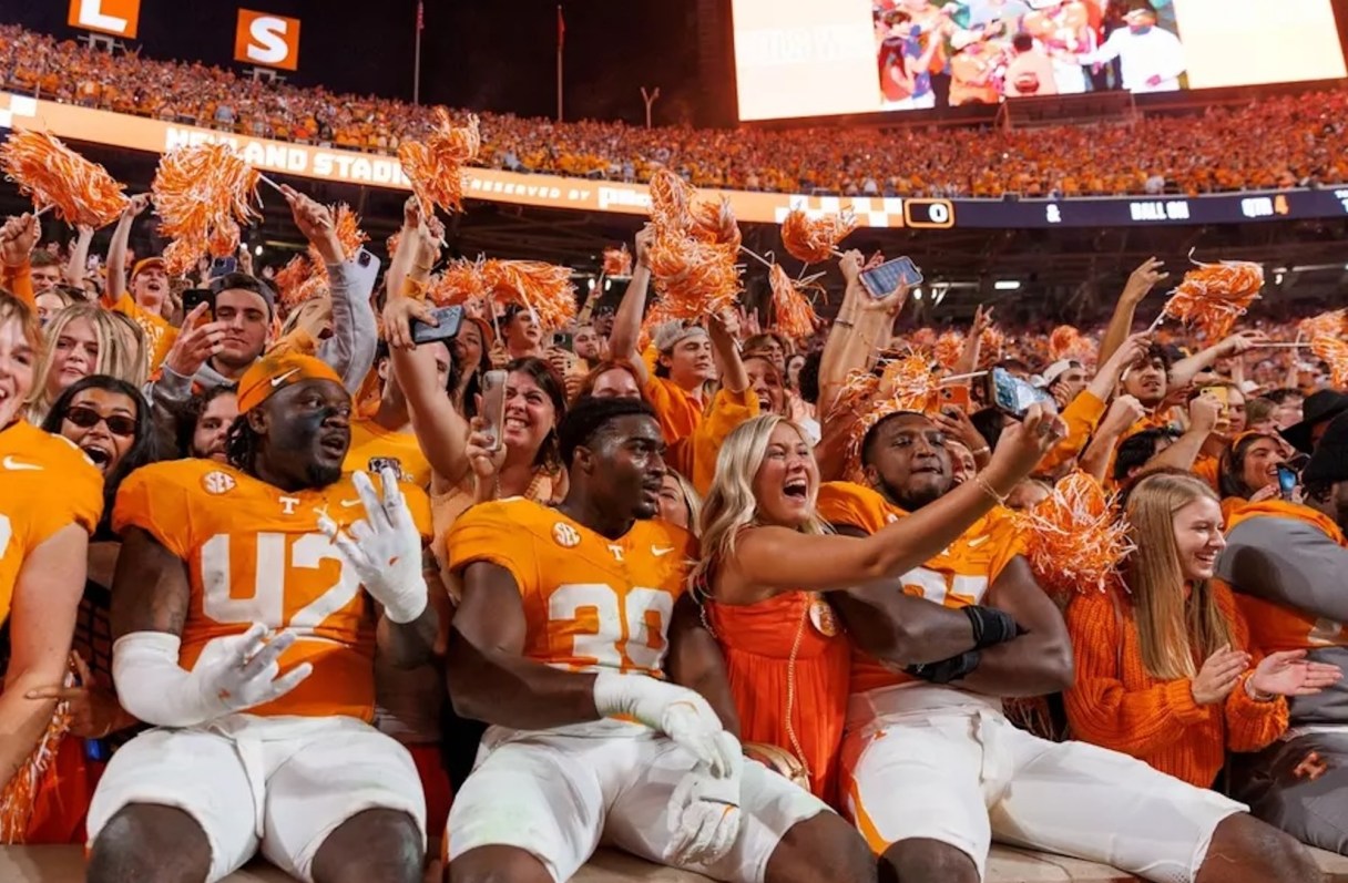 Tennessee Athletics photo by Andrew Ferguson / Tennessee football players celebrate with fans after last October's 24-17 downing of Alabama inside Neyland Stadium.
