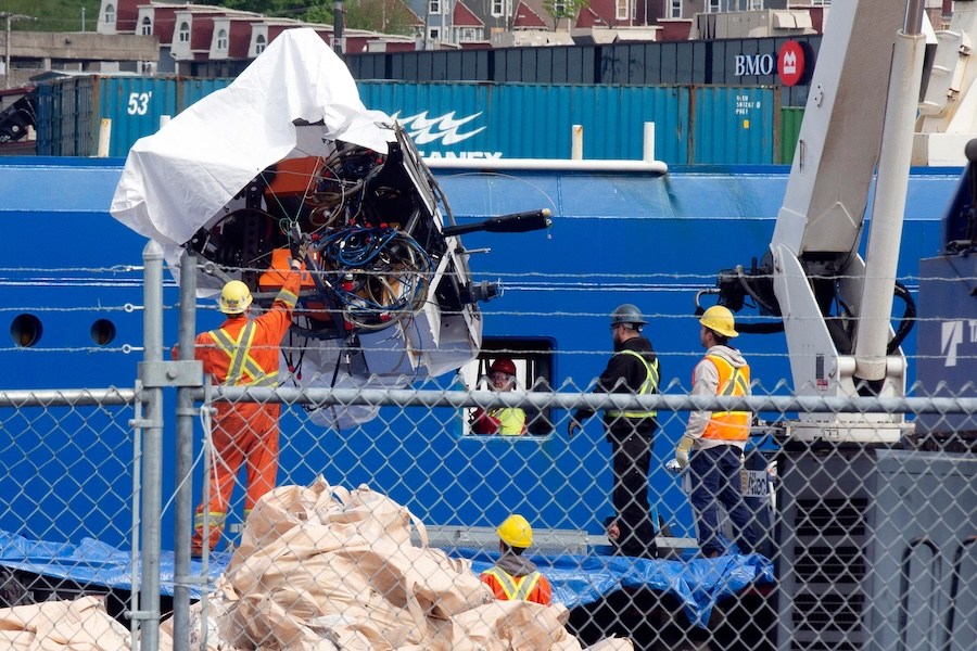 FILE - Debris from the Titan submersible, recovered from the ocean floor near the wreck of the Titanic, is unloaded from the ship Horizon Arctic at the Canadian Coast Guard pier in St. John's, Newfoundland, June 28, 2023. (Paul Daly/The Canadian Press via AP, File)