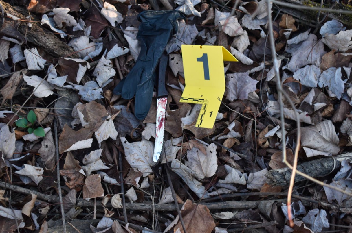 Tennessee Bureau of Investigation / A glove and knife are seen in one of a collection of photographs used during the Tennessee Bureau of Investigation's review of a Dec. 24, 2024, shooting involving two Chattanooga police officers.