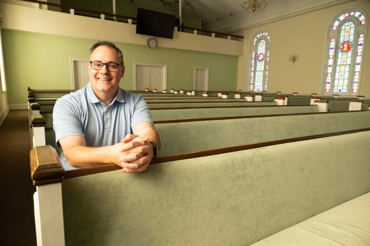 Staff photo by Seth Carpenter / Scott Harris, Hamilton County Baptist Association missions director, sits in a pew inside the White Oak Baptist Church access campus.