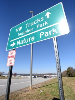 Staff file photo by Matt Hamilton/ A sign directs traffic near the intersection of Volkswagen Drive and Ferdinand Piech Way on Wednesday, Nov. 12, 2025. A proposed road extension in the area has drawn opposition.