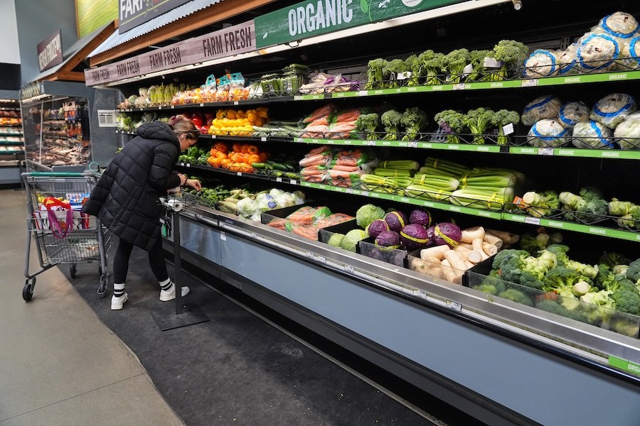 A person shops for produce, which is covered by the USDA Supplemental Nutrition Assistance Program (SNAP), at a grocery store in Baltimore, Monday, Nov. 10, 2025. (AP Photo/Stephanie Scarbrough)