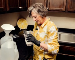 Diana McBride measures ingredients for her lemonade in a new backstage kitchen at the Grand Ole Opry in Nashville, Tenn., Nov. 20, 2025. McBride, one of the legions of workers who perform a variety of tasks that help make the venerable venue something special, is known for her lemonade that is only available backstage. (Houston Cofield for The New York Times)