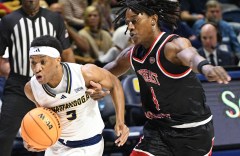 Staff Photo by Robin Rudd / UTC's Jordan Prison (5) is fouled by Southeast's Troy Cole Jr.. The University of
Tennessee at Chattanooga Mocs hosted the Southeast Missouri State University Redhawks in a NCAA basketball game, at McKenzie Arena, on Dec. 6, 2025.