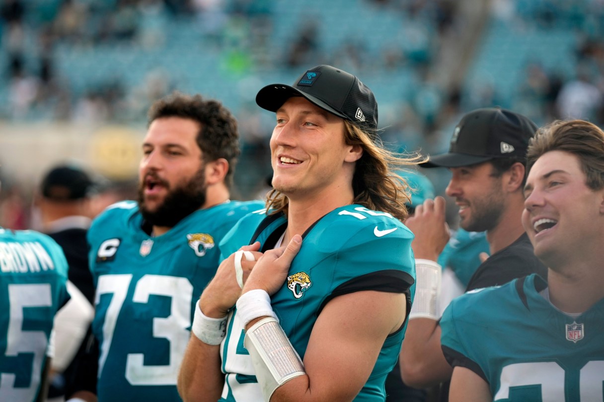 AP photo by John Raoux / Jacksonville Jaguars quarterback Trevor Lawrence, center, watches during the team's home win against the New York Jets last Sunday.