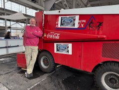 Staff Photo by Kailee Shores / Bill Matthews, the lead ice technician for Ice on the Landing, stands next to the Zamboni machine that is used to resurface the ice at the rink.