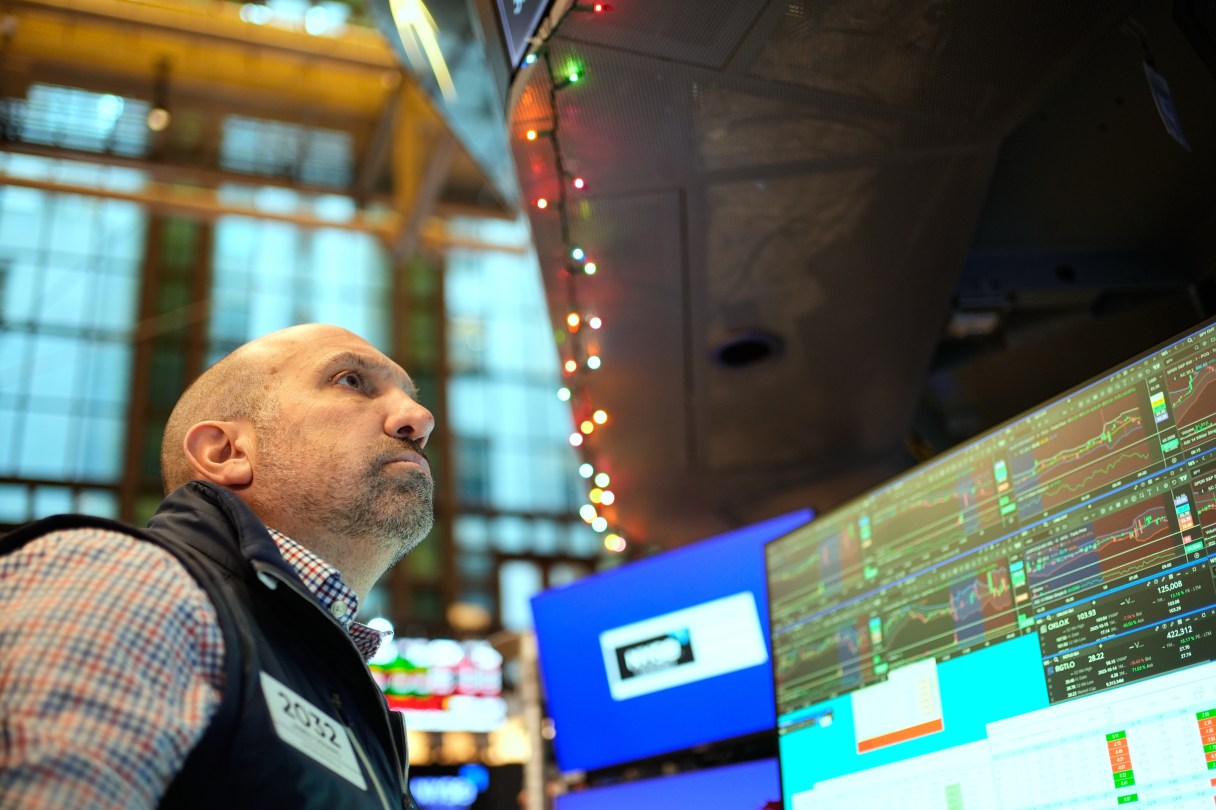 James Denaro works on the floor at the New York Stock Exchange in New York, Wednesday, Dec. 10, 2025. (AP Photo/Seth Wenig)
