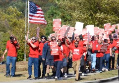 Staff File Photo / United Auto Workers members march to Volkswagen's Chattanooga entrance in opposition to accepting the company's final offer.