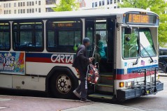 Staff file photo / Passengers load onto a CARTA bus in 2023.