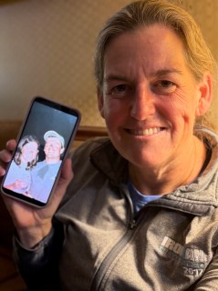 Staff photo by Mark Kennedy / Tracy Daverson, 49, holds a photo of herself and her late husband, Patrick Daverson. Patrick Daverson, 52, was a Signal Mountain father and high school coach who died of a heart attack in November 2025.
