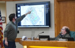 Staff photo by Matt Hamilton/ Planning Commission member Jaime Blanton looks on as engineer Derek Kilday points out features on a map during a meeting of the Signal Mountain planning commission at Signal Mountain Town Hall.