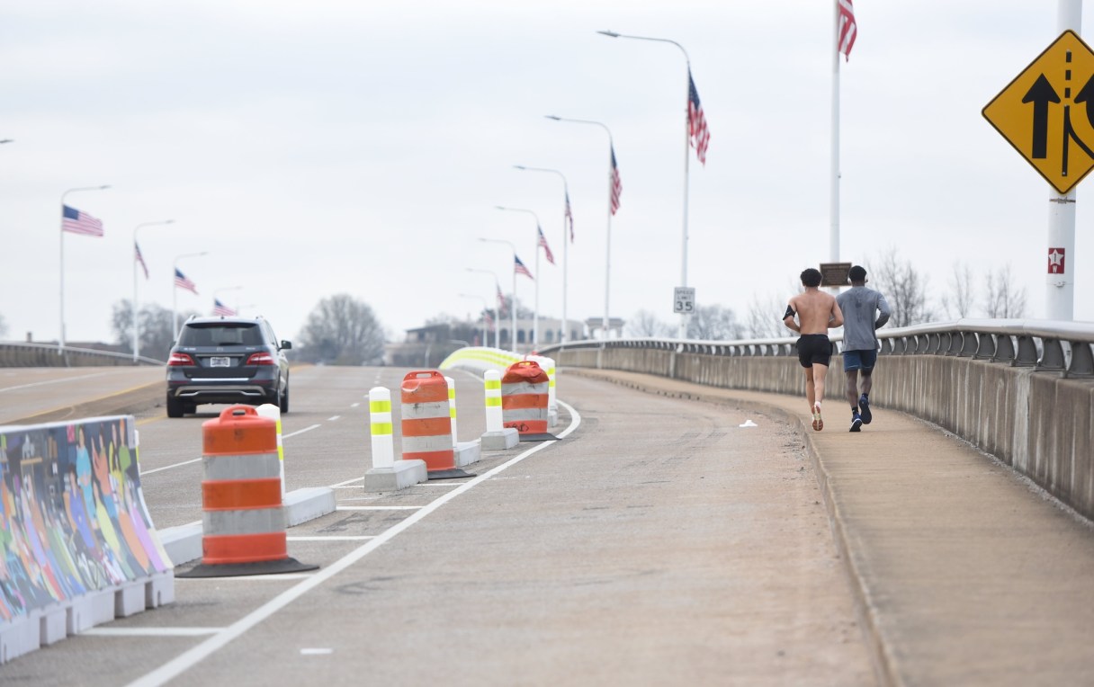 Staff photo by Matt Hamilton / Pedestrians and cars share Veterans Memorial Bridge on Friday, March 14, 2025.
