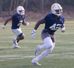 Staff File Photo by Larry Sullivan II/UTC linebacker Zion Rutledge runs to the football during a spring practice at Scrappy Moore Field. The Mocs hope a slimmed-down version of last year's leading tackler will make even more plays in the 2026 season.