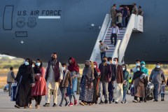 Photo by Cristina Quicler/AFP via Getty Images/TNS / Refugees disembark from a US air force aircraft after an evacuation flight from Kabul at the Rota naval base in Rota, southern Spain, on Aug. 31, 2021.