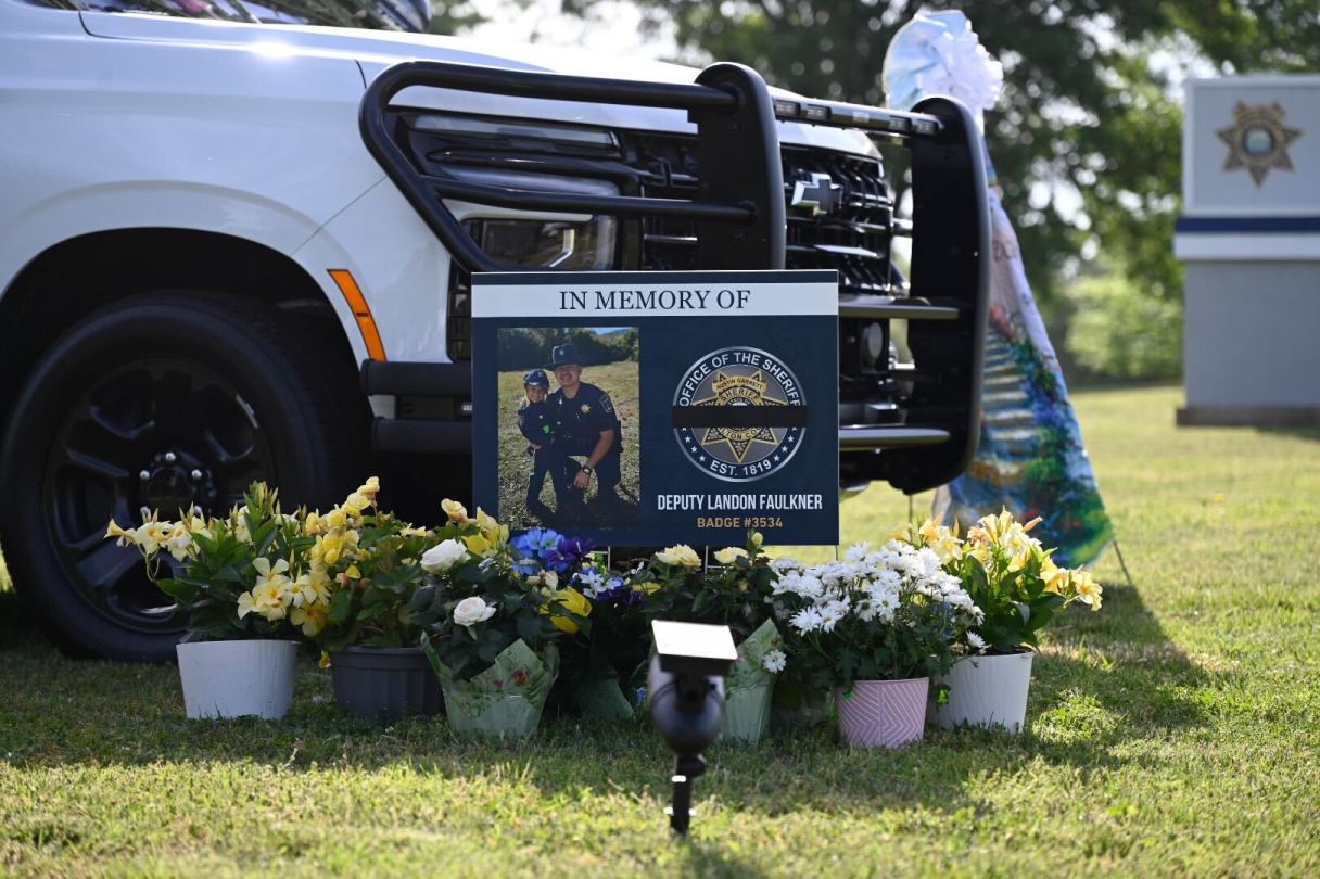 Staff photo by Mason Edwards / Flowers sit at the memorial for Hamilton County sheriff's deputy Landon Faulkner at the law enforcement operations center at 6125 Preservation Drive in Chattanooga.