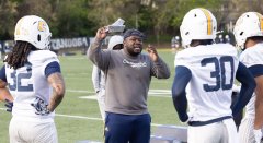 Staff photo by Larry Sullivan II / D.J. Knox, center, coaches UTC running backs during a March 24 spring practice at Scrappy Moore Field.