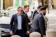 FILE — Elon Musk, center, arrives at the Phillip Burton Federal Building and U.S. Courthouse in San Francisco, March 4, 2026. SpaceX, Musk’s rocket and satellite maker, filed confidentially for an initial public offering on Wednesday, April 1, 2026, according to two people familiar with the company, setting the stage for what could be one of the largest offerings ever. (Jason Henry/The New York Times)