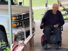 Staff photo by Mark Kennedy / Phil Spencer of Ringgold watches a nesting dove on his porch bannister. The dove had tried to build the nest in his Chevrolet pickup truck.
