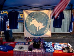 A merchandise table provides options for people to show their support of the Davidson County Democratic Party. (Martin B. Cherry / Nashville Banner)