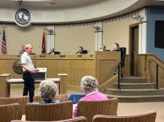 Staff photo by Emily Crisman / Ben Chandler of Easy Auto Powersports speaks to East Ridge residents attending a City Council meeting at City Hall to oppose his request to rezone property in their neighborhood to expand the business, which sells motorcycles and all-terrain vehicles.