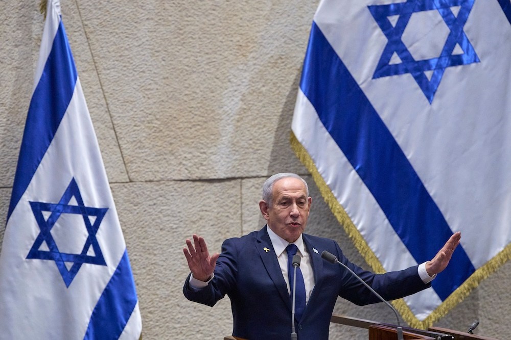 Israel's Prime Minister Benjamin Netanyahu addresses lawmakers in the Knesset, Israel's parliament, in Jerusalem, Monday, Nov. 10 2025. (AP Photo/Ohad Zwigenberg)