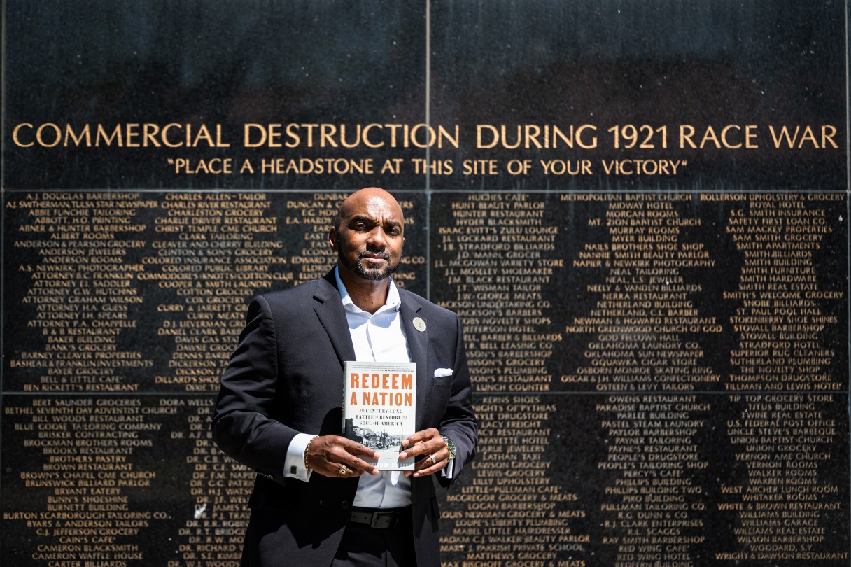 Damario Solomon-Simmons poses for a portrait at the memorial for the 1921 Tulsa Race Massacre on Saturday, May 2, 2026, in Tulsa, Okla. Solomon-Simmons is the author of a new book about reparations over the Tulsa Race Massacre (AP Photo/Milo Gladstein)